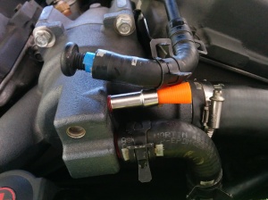 disconnected-thermostat-housing-bypass-hose-on-an-aston-martin-db9