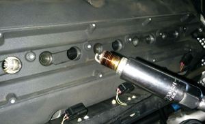 spark-plug-being-removed-from-an-aston-martin-db9